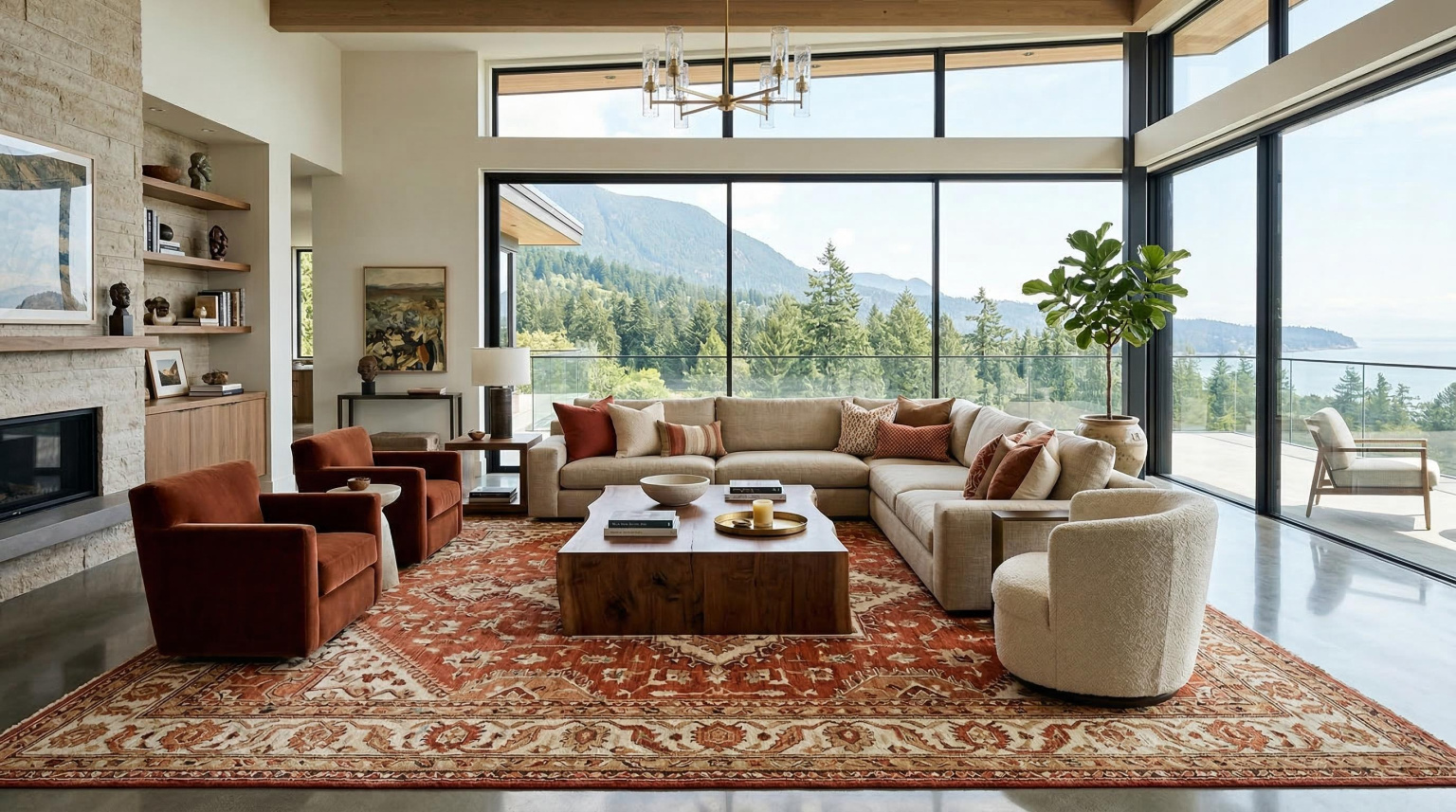 Expansive luxury living room with an oversized hand-knotted rug in warm terracotta and ivory geometric pattern fully anchoring a large seating arrangement of bespoke sofas, with floor-to-ceiling windows and polished concrete floor beyond the rug's edge
