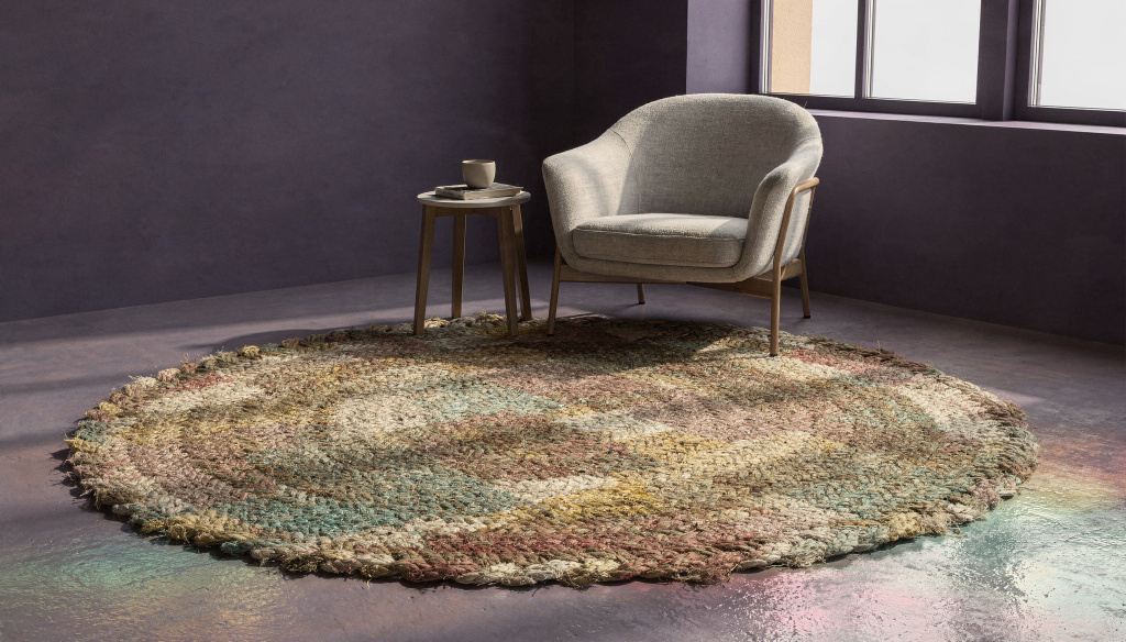 Earth-toned rug adding warmth to a deep purple interior